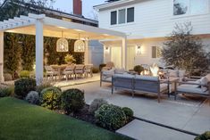 an outdoor living area with seating and fire pit