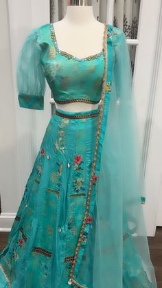 😍👗Trendy and unique!! This mesmerizing lehenga choli dances with elegance akin to the serene waves of an ocean. The organza puff hands delicately elevate its allure, adding a whimsical touch that intertwines charm and sophistication, creating an ensemble that shimmers and glows with ethereal grace.✨😍 Size 38 lehabga waist : 30 in supported with eleastic band lehanga height: 41 in #TurquoiseSilkLehengaCholi #TrendyLehenga #EthnicFashion #LehengaLove #IndianCouture #Fashionista #TraditionalWear Puff Hands, Silk Lehenga Choli, Indian Couture, Silk Lehenga, Turquoise Color, Lehenga Choli, Ethnic Fashion, Lehenga, Puff Sleeve