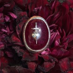 As a wise man once said, grief is the price we pay for love... The Sword-Pierced Heart ring is a brand-new addition to the world of Medieval-inspired works by Alex Streeter. This bold yet sophisticated ring is available in Black and Crushed Ruby - perfect for both men and women looking to add a unique statement piece to their collection. Ruby has long been considered a talisman of love and was a once a very popular choice for engagement rings.This motif was originally inspired by medieval portra Vampire Ring, Medieval Rings, Unique Mens Rings, Edgy Jewelry, Wise Man, Witch Aesthetic, Silver Accessories, Wedding Board, Ruby Ring