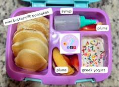 a purple lunch box filled with lots of food