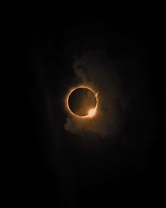 the eclipse is seen through clouds in this photo taken by nasa astronauts on july 22, 2013