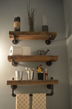 two wooden shelves above a toilet in a bathroom