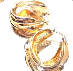 These are absolutely Georgeous 18 Karat Gold over brass Hoop Earrings. Nice size....definitely an attention getter! In great shape. Wonderful gift!! Gold-tone Small Hoop Earrings As Gift, Small Gold-tone Hoop Earrings As Gift, Gold Metal Clip-on Hoop Earrings, Gold Nickel-free Hoop Earrings For Anniversary, Yellow Gold Hoop Clip-on Earrings For Gift, Yellow Gold Hoop Clip-on Earrings As Gift, Gold Clip-on Hoop Huggie Earrings, Elegant Gold Hoop Earrings Cadmium-free, Gold-tone Metal Hoop Earrings For Anniversary