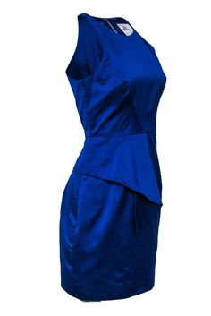 Go for a regal look at your next formal event with this dress from Milly! A vibrant royal blue tones and asymmetrical flounce add edge to this luxe frock. Pair with sparkly heels and a clutch for a gorgeous eye-catching look. Size 6 Shell: 55% Polyester, 45% Cotton Lining: 100% Polyester Made in USA Exposed back zipper Lined Sheath silhouette Scoop neckline Sleeveless Asymmetrical flounce on hem Bust 33" Waist 29" Shoulder to hem 35" Blue Fitted Mini Dress With Side Zipper, Elegant Asymmetrical Summer Dress With Side Zipper, Blue Dress With Asymmetrical Neckline For Formal Occasions, Blue Dresses With Side Zipper, Chic Fitted Royal Blue Dress, Blue Dress With Ruffles And Asymmetrical Neckline, Fitted Royal Blue Chic Dress, Fitted Chic Royal Blue Dress, Elegant Asymmetrical Dress With Side Zipper For Spring