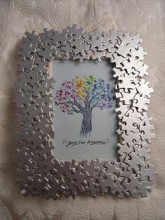 a puzzle frame with a tree painted on it