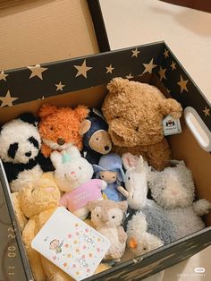 a box filled with stuffed animals on top of a table