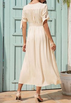 The EMES SHOP dress is detailed with fun tie sleeves. Features a v neck line. button down design. short sleeves. flowy dress. and mid-calf length. Pair it with sunnies and espadrilles for a magnificent summer look.MATERIALS: 91-99 % PolyesterMEASUREMENTS: Product length is 50"-51.9" 4-6-Small | Waist: 25-26.5 in | Chest: 33-34.5 in | Hips: 35-36.5 in 6-8-Medium | Waist: 26.5-28 in | Chest: 34.5-36 in | Hips: 36.5-38 in 8-10-Large | Waist: 28-29.5 in | Chest: 36-37.5 in | Hips: 38-39.5 in 10-12-X Summer V-neck Maxi Dress With Tie Fastening, V-neck Rayon Midi Dress With Tie Waist, Casual Mid-length Midi Dress For Beach, Short Sleeve Midi Dress For Summer Vacation, V-neck Summer Dress With Tie Sleeves, V-neck Dress With Tie Sleeves For Summer, Beach Rayon Maxi Dress With Tie Waist, Casual V-neck Midi Dress With Tie Fastening, Casual Rayon Maxi Dress With Tie Waist