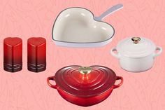 red and white kitchenware on pink background with heart - shaped dish, oven mitts, creamer