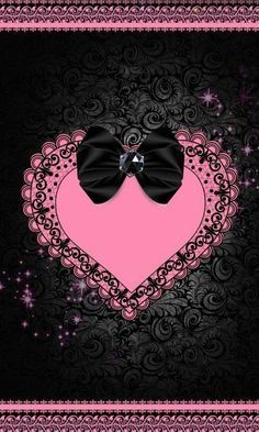 a black and pink heart with a bow on it's side in the center