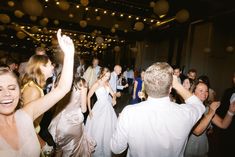 a group of people dancing at a party