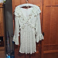 Nwt, Babydoll Style Dress With Ruffle Neckline, And Sleeves And A Flowy Skirt.The Long Sleeves Have Ruffles On The Inside With 3 Buttons On Each Cuff. Fully Lined With An Invisible Side Zipper. Bell Cuffs. Size 2 By Free People. Measures 16" Armpit To Armpit, 35" Shoulder To Hem. 100% Viscose For Both The Lining And Body. Hand Wash, Line Dry. Make An Offer!:) Babydoll Style Dress, Free People Maxi, Printed Tunic Tops, Babydoll Style, Ruffled Dress, Midi Dress Summer, Boho Festival, Flowy Skirt, Print Tunic