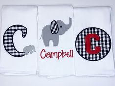 three personalized towels with an elephant, letter g and the word campbell on them