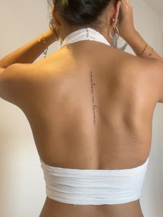 a woman with a tattoo on her back