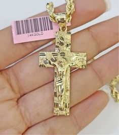 We present You with This Absolutely Stunning Real 14k Nugget Cross Charm. It has a detailed cut with a very good finish. This Pendant will not tarnish, discolor, or fade because they are Pure 14K Gold. Please feel free to contact us if you have any queries regarding the item.   Charm: Metal:14k Gold  Weight : 3-4 Grams  Weight and Width are approximate ,+/- 10% expected. Chain not included RETURN POLICY The item has to be in its original unworn condition and should be with the tag All the access Gold Crucifix Jewelry Stamped 14k, Gold Diamond Cut Crucifix Jewelry, Hallmarked Yellow Gold Crucifix Jewelry, Engraved Yellow Gold Crucifix Jewelry, 14k Gold Cross Jewelry With Diamond Cut, 14k Gold Diamond Cut Cross Jewelry, 14k Gold Crucifix Jewelry, 14k Gold Stamped Crucifix Jewelry For Anniversary, 14k Stamped Crucifix Jewelry For Anniversary