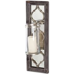 a candle holder with a glass and metal frame in the shape of a wall hanging