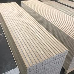 several stacks of wooden boards stacked on top of each other