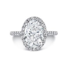 an oval cut diamond ring with pave set shoulders