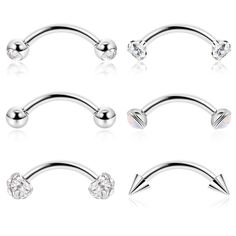 four pairs of surgical steel nose piercings with clear crystal stones on each one side