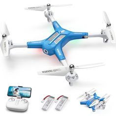 a blue and white remote controlled quadcopter is shown with other items surrounding it