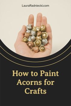 a hand holding gold and silver rocks with the words how to paint acorns for crafts