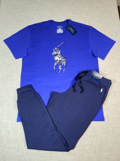 POLO RALPH LAUREN Mens Camo T-Shirt & Waffle Knit Jogger Pants Pajama Sleep Lounge wear Set Blue Medium BRAND NEW WITH TAGS Men's Size Medium Ships with USPS Priority Mail except on weekends and holidays. * Please note, USPS is experiencing an increase in packages. Delivery times may take longer than normal. Polo Joggers Outfit Men, Navy Casual Loungewear Sets, Casual Blue Long Pants Sets, Casual Blue Crew Neck Sleepwear, Blue Polo Shirt For Streetwear, Navy Cotton Loungewear Sets, Blue Crew Neck Loungewear Set, Casual Blue Short Sleeve Sleepwear, Lounge Wear Set