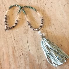 This necklace consists of a gorgeous green sari silk tassel strung with bronze glass pearls, champagne colored crystal beads, and green turquoise fire polished Czech beads. The necklace has a lobster clasp closure.  The necklace measures 26 inches long, and the tassel measures 5 inches in length. Follow Immeasurably More on Instagram immeasurablymore_) for special announcements, coupon codes, and giveaways. Adjustable Green Beaded Tassel Necklace, Green Beaded Bohemian Tassel Necklace, Green Bohemian Beaded Tassel Necklace, Handmade Green Bohemian Tassel Necklace, Bohemian Green Beaded Tassel Necklace, Turquoise Beaded Necklaces With Tassels For Gift, Green Sari, Silk Tassel Necklace, Boys Necklace