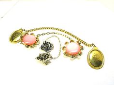 "Ask me about the \"SPECIAL DISCOUNT\" on your purchase of multiple listings/items! All items must be purchased at the same time on one order.   Nice vintage set of 3 sweater clips with chains. Gold tone monogrammed is 9\" end to end, Silver tone rose is 8\" and the large pink lucite flower in gone tone is 7.5\" end to end. The pink flower clips are \"patent pending\". Nice vintage set with some slight age/use wear. One price for all 3!" Vintage Sweater Clips, Sweater Clips, Sweater Clip, Vintage Pullovers, Pink Acrylic, Gold Monogram, Pink Acrylics, Flower Clip, Shoe Clips