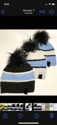 two crocheted hats with black and blue fur pom - poms on them