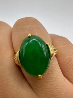 "Vintage Lucky Green Nephrite Jade ring Fun jade is color enhanced  Large green nephrite jade  Ornate German Gold finished Vintage ring, does not tarnish, NOT sterling Size 7, 7.5, 8, or 9.25  Our jeweler can re size for a $20 fee.  All rings are shipped free in the US in a nice gift box.   Check out our over a THOUSAND great reviews Engraving is $4 per letter and is not always perfect depending on the piece. It can take a few days if the jeweler is busy. This is payable to Paypal Judithsltd@gma Green Emerald Oval Cabochon Ring, Green Emerald Ring With Oval Cabochon, Oval Jade Rings Hallmarked, Green Oval Gemstone Rings, Fine Jewelry Green Oval Cabochon Rings, Fine Jewelry Green Oval Cabochon, Oval Green Jewelry With Polished Finish, Fine Jewelry Jade Oval Ring, Oval Jade Ring Fine Jewelry