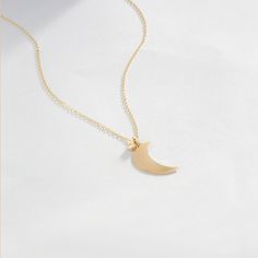 "Time to show your love is to the moon and back. Love yourself or gift her with a 14k gold moon necklace. A birthday, Galentine's day or just a lucky Friday is the perfect gifting day. F E A T U R E S * Made to Order. * Gold KT: 14K * Choice of Gold Color: Yellow Gold, Rose Gold, White Gold * Gem Stone: Genuine Diamond * Diamond-Cut: Round * Diamond Carat: 0.01 ct * Pendant Height: 15.5 mm / 0.61 inch * Pendant Width: 9 mm / 0.35 inch * Diamond Color-Clarity: H Color, SI Clarity * Length: 14\", Minimalist Yellow Gold Half Moon Jewelry, Minimalist Yellow Gold Moon Necklace, Minimalist Yellow Gold Moon Jewelry, Minimalist Moon Shaped Jewelry For Anniversary, Minimalist Moon-shaped Jewelry For Anniversary, Minimalist Rose Gold Moon-shaped Jewelry, Minimalist Moon Shaped Gold Jewelry, Minimalist Moon Shaped Necklace For Anniversary, Minimalist Moon-shaped Gold Jewelry