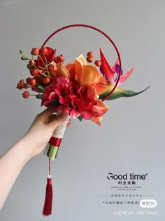 a person holding a bouquet with flowers in their hand and the words good time written on it