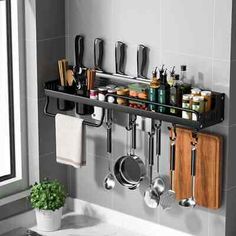 there is a shelf with utensils and other kitchen items on it in the bathroom