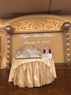 a table topped with lots of cake next to a sign that says roger's sweet sixteen