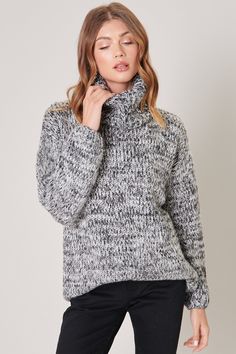 Cozy vibes in our chunky and comfy Salt and Pepper Tunic Sweater. Pair it with leggings and a beanie for a lazy day around the house.- Turtleneck sweater- Chunky marled yarn- Drop shoulder with volume sleeve- Tunic length- Color: GraySize + Fit- Model is 5'10" and wearing size S- Measurements taken from size S- Chest: 46 1/2"- Length: 27"Fabric100% AcrylicStyle Number T9172ST Winter Must Haves, Thick Sweaters, Cozy Vibes, Lazy Day, Tunic Length, Tunic Sweater, Wool Sweaters, Grey Sweater, Turtleneck Sweater