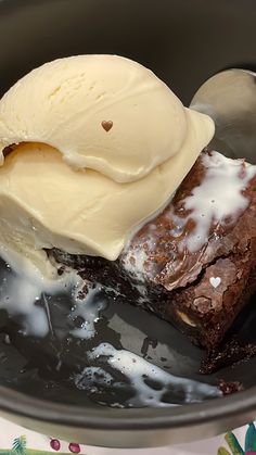 a piece of cake and ice cream in a bowl