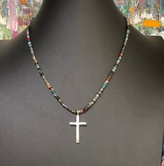 "BOHO UNISEX beaded choker in different sizes. Adjustable lengths. Nina Dunn ancient  silver hammered large cross pendant. Also comes in gold and Sterling Silver. Stainless large clasp with extension. Different sizes available. The necklace listed is 18.5\". Other sizes made to order. Free gift of the month and free shipping for purchases over $35. Exclusive Studio design (each beaded necklace is original, even with the same bead mix, they are all unique artistic works.) All jewelry is handmade, Bohemian Cross Jewelry For Healing, Beaded Spiritual Cross Pendant Necklace, Silver Cross Beaded Necklace For Spiritual Style, Silver Spiritual Cross Beaded Necklace, Spiritual Silver Cross Beaded Necklace, Spiritual Cross Necklace With Polished Beads, Silver Bohemian Cross Necklace, Personalized Pendant, Studio Design