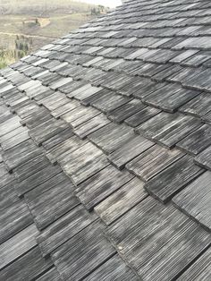 the roof of a building that has been made out of wood planks and shingles