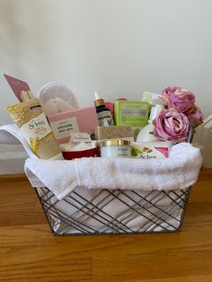 a basket filled with personal care items on top of a wooden floor