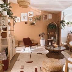 a living room filled with lots of furniture and plants on top of it's walls