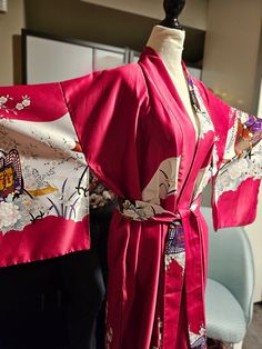 This is such a beautiful Vintage Japanese Kimono robe. It can be worn as a house robe or wear it out, throw on some skinny jeans, high heels , black tank and hit up the town. Your sure to get many compliments. It's pink with a rickshaw/floral print. The fabric is polyester, feels so soft and silky. The length is 56 inches, Its a one size fits most. It is a traditional kimono with open sleeves which are nice and long, comes with a matching fabric belt. Its in great condition.  This item is pre-lo Elegant Kimono With Kimono Sleeves For Home, Silk Home Kimono With Kimono Sleeves, Long Kimono For Home, Traditional Kimono Sleeve Robe For Home, Long Red Kimono For Loungewear, Traditional Robe With Kimono Sleeves For Home, High Heels Black, Traditional Kimono, Vintage Japanese Kimono