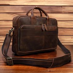 "Personalized 16\" Leather Briefcase, Full Grain Leather bag, Leather Messenger Bag, , Leather Laptop Bag, Crossbody Bag, Best Gift, Gift For Him Her 𝗛𝗮𝗻𝗱𝗺𝗮𝗱𝗲 𝗚𝗲𝗻𝘂𝗶𝗻𝗲 𝗟𝗲𝗮𝘁𝗵𝗲𝗿 𝗕𝗿𝗶𝗲𝗳𝗰𝗮𝘀𝗲 𝗕𝗮𝗴 𝗪𝗶𝘁𝗵 𝗟𝗮𝗽𝘁𝗼𝗽 𝗦𝘁𝗼𝗿𝗮𝗴𝗲 The ultimate travel companion! Our leather briefcase bag combines functionality, durability, and style, making it the perfect choice for your travels, place of work, school, college, universitiy or as a thoughtful gift for special occasions. 🌟 𝗞𝗲𝘆 𝗙𝗲𝗮𝘁𝘂𝗿𝗲𝘀: 𝗣𝗿𝗲𝗺𝗶𝘂𝗺 𝗤𝘂𝗮𝗹𝗶𝘁𝘆: Crafted from genuine cowhide leather, our briefcase bag is not only soft and luxurious but also sturdy and durable. The high-quality zippers, robust stitches,  and firm build ensure that this bag is made to last. 𝗔𝗱𝗷𝘂𝘀𝘁𝗮𝗯𝗹𝗲 𝗦𝗵? Workplace Leather Satchel Bag, Leather Satchel For Workplace, Leather Satchel For The Workplace, Leather Satchel Bag For Workplace, Leather Bags For Workplace, Rectangular Leather Bag For The Workplace, Rectangular Leather Bag For Workplace, Rectangular Leather Bags For The Workplace, Rectangular Leather Bags For Workplace