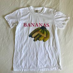 Bananas Graphic Tee, Fruit Shirt, Fruit Shirt, Fruit Shirt, Gift for Her, Vintage Unisex T-Shirt * 100% ring-spun cotton * Fabric weight: 6.1 oz/yd² (206.8 g/m²) * Garment-dyed * Relaxed fit * 7/8″ double-needle topstitched collar * Twill-taped neck and shoulders for extra durability * Double-needle armhole, sleeve, and bottom hems Funny Crew Neck Top With Front Print, Funny White Cotton Shirt, White Cotton Shirt With Funny Style, Funny Short Sleeve Top With Front Print, Unisex White Tops With Funny Print, Unisex White Shirt With Funny Print, White Funny Shirt With Screen Print, Funny White Shirt With Screen Print, White Relaxed Fit Funny Top