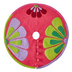 a pink and green flowered pot holder cover on a white background with red trim