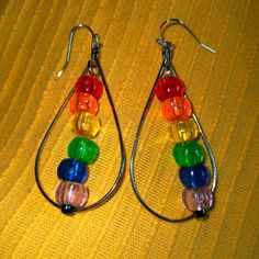 New Lgbt Rainbow Pride Teardrop Hoop Earrings Handmade With Silver Plated Earring Hooks Hoops And Bright Colorful Beads This Would Be Essential For Gay Pride Month And Can Be Worn Year Round These New Dangling Statement Earrings Are Hand Crafted An Essential For Anyone Who Loves Jewelry And Beautiful Accessories They Would Be Perfect For A Summer Vacation Or Date Night And Would Make A Great Gift For Yourself Or Someone You Care About Made With Hypoallergenic Materials Nickel Free About 2 Inch L Rainbow Metal Earrings With Ear Wire, Rainbow Metal Earrings, Colorful Teardrop Jewelry, Rainbow Dangle Metal Earrings, Nickel-free Rainbow Teardrop Earrings, Rainbow Teardrop Jewelry For Party, Rainbow Nickel-free Dangle Hoop Earrings, Rainbow Metal Drop Earrings, Nickel-free Rainbow Dangle Hoop Earrings