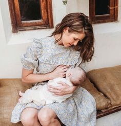 With its flowy full skirt and pastel meadow print, the Esther Nursing Dress inspires grace and movement. It features a fine high-necked ruffled collar, puffy sleeves, organic ultra-light cotton lining, pockets, and a feminine waist marked through a soft elastic. Delicate double-ruffled trims conceal two invisible zippers for ease of breastfeeding. Crafted from a sumptuous organic cotton fabric with a silk-like touch, the Esther Nursing Dress is ideal to wear at home, to the office, or anywhere e Mother Clothes, Breastfeeding Dresses, Nursing Dress Breastfeeding, Feeding Dresses, Estelle Dress, Breastfeeding Friendly Dresses, Nursing Friendly Dress, Pregnancy Dress, Breastfeeding Dress