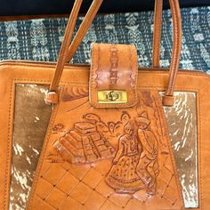 This Vintage Tooled Leather Purse Is From Mexico. Has Detailed Tooling On Both Sides And Ponyhair Trim. Interior Is Leather Lined With 3 Interior Compartments (One Zip) And 2 Zip Pockets. Awesome 3d Designs With Dancers And Pyramids/ Cactus In The Background. 2 Panels Of Spotted Cowhide Surround. Aztec/ Mayan Calendar On Back With Beautiful Tooled Detail Throughout Including The Bottom. A Couple Of Minor Scratches As Pictured And Tear On Back Side Of Panel That Has Clasp. Inside Is Very Clean, V Aztec Motifs, Vintage Tooled Leather Purse, Cowhide Purse, Mayan Calendar, Tooled Leather Purse, Vintage Tools, Hand Tooled Leather, Mexican Folk Art, Tooled Leather