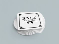 four coasters sitting on top of each other in front of a gray background with the words wv waters