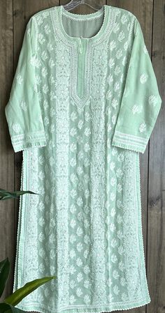 Soft cotton hand embroidered Kurta ! Kurta Length:46 inches Liner included. Pair it with soft cotton pants in white. Sold separately. White Cotton Traditional Wear With Chikankari Embroidery, White Cotton Traditional Wear For Spring, Traditional Cotton Kurta With Lace Work, Green Cotton Traditional Wear With Chikankari Embroidery, White Cotton Traditional Wear With Cutwork, White Mulmul Traditional Wear For Spring, Green Lucknowi Kurta, Long Sleeve Cotton Sets With Cutwork, Traditional Cotton Set With Cutwork