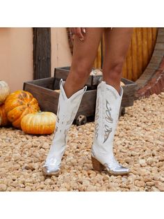 Step up your cowgirl style with these Stunning Silver Metallic Cowboy Boots! These boots feature butterfly embellishments that add a touch of femininity to the authentic cowgirl design. Made with high-quality materials, these boots are durable and stylish. Perfect for any cowgirl looking to make a statement. Color : Silver Closure Type : Slip on Insole Material : Polyester Lining Material : Polyester Outsole Material : TPR Upper Material : PU Leather Composition : 100% Polyurethane White Boots For Western-themed Fall Events, White Boots For Ranch In Fall, White Mid-calf Boots For Ranch In Fall, White Boots For Western-themed Events, White Mid-calf Boots For Fall Rodeo, White Boots For Summer Rodeo, White Summer Rodeo Boots, White Summer Boots For Rodeo, White Boots For Summer Western-themed Events