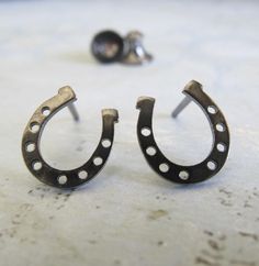 When kept as a talisman, a horseshoe is said to bring good luck. Some believe that to hang it with the ends pointing upwards is good luck as it acts as a storage container of sorts for any good luck that happens to be floating by. Wear these earrings to bring luck your way. The Details ∞ Artisan handmade ∞ Tiny horseshoe studs (approx 9.6mm x 8.5mm) ∞ Choose from sterling silver, 14k gold-filled or solid 14k yellow gold ∞ Pictured in polished, antiqued and oxidized sterling ∞ Earring backs inclu Artisan Jewelry Handmade, Gold Filled Earrings, Yellow Gold Earring, Oxidized Sterling Silver, Storage Container, Polish Jewelry, Gold Filled Jewelry, Earring Backs, Sterling Earrings